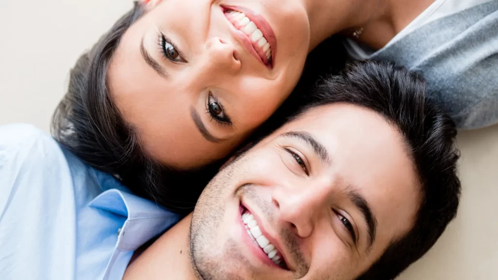 Social Dynamics and the White Smile